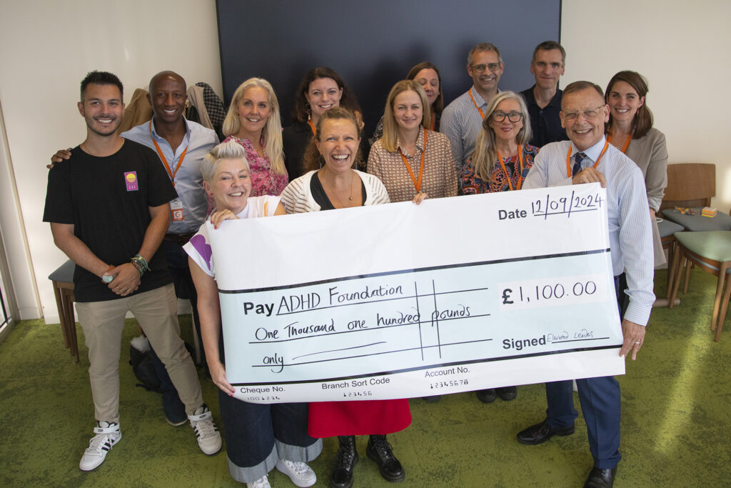 Jane Livesey & Jenny Martin with workshop participants at Salesforce Tower presenting cheque for £1,100 to ADHD UK Foundation
